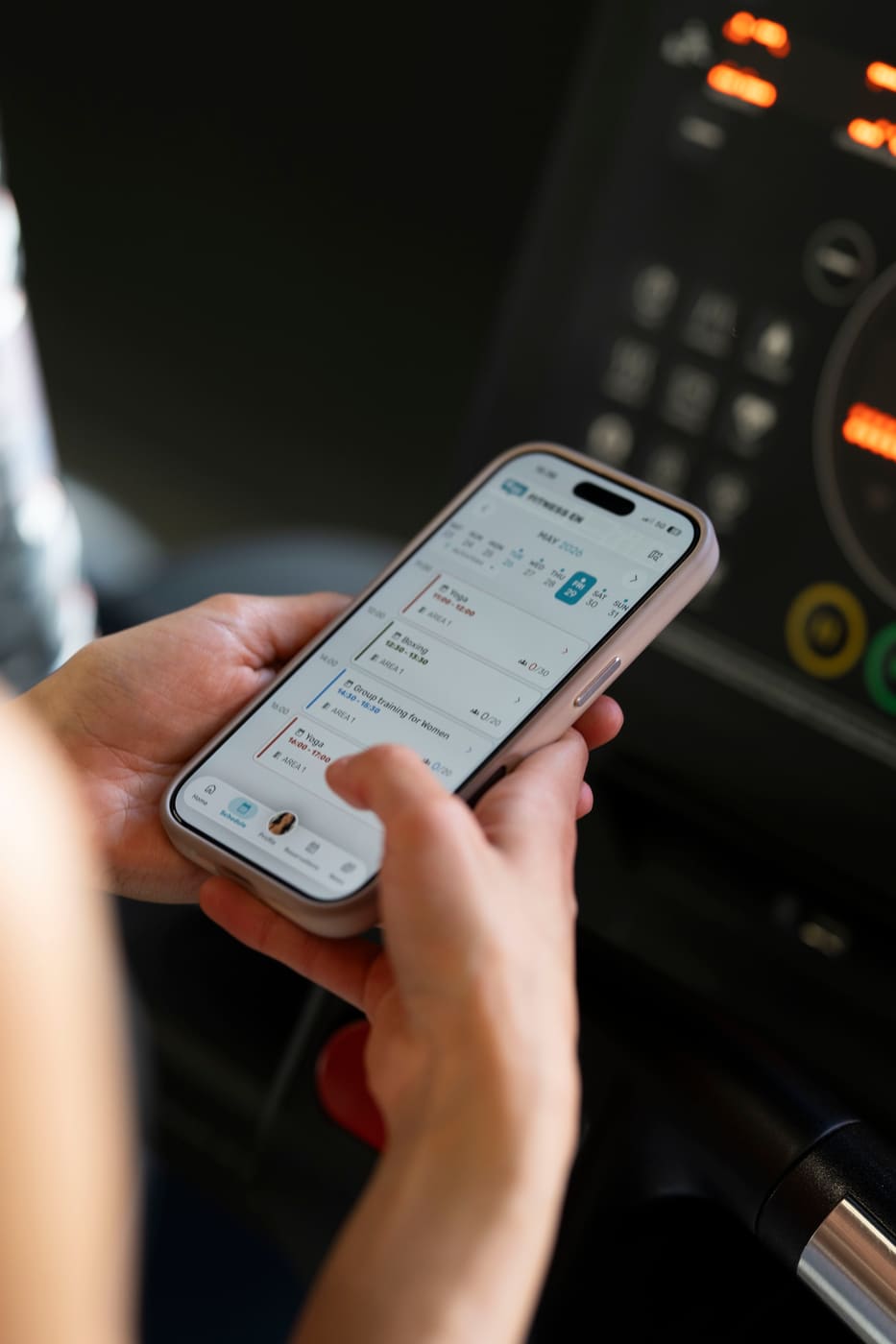 Member using the GymRealm branded gym mobile app